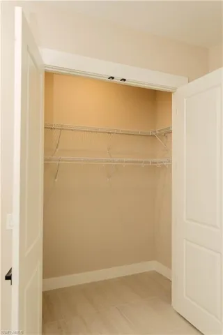 View of custom shelving added in guest room closet