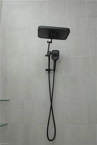 Master bathroom with tiled shower, upgraded matte black fixtures