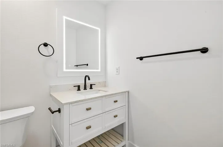 Bathroom with vanity and toilet