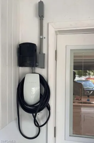 includes a private Level 2 EV charger located directly in the assigned parking space, a rare and highly sought-after feature that sets this home apart.