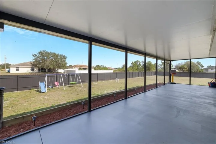 Unfurnished sunroom featuring a wealth of natural light