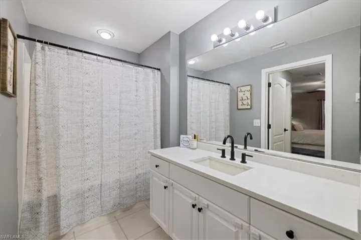 Bathroom with vanity and tile patterned floors