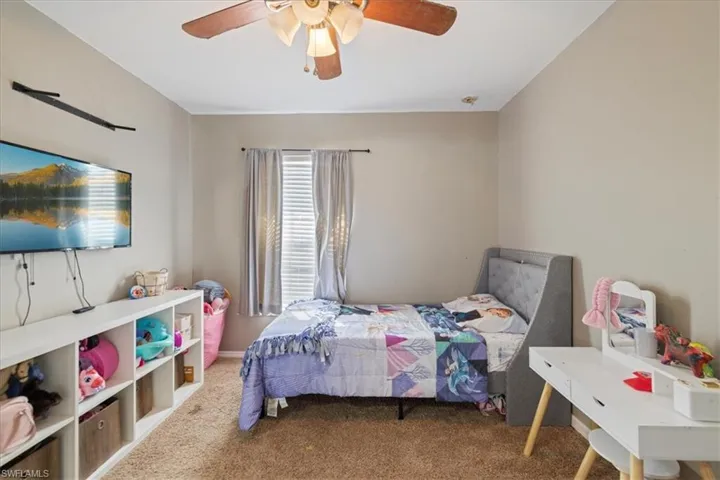 Bedroom with carpet floors and ceiling fan