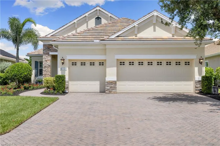 View of front of property with a garage