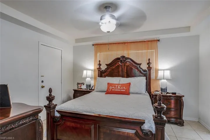 Owners Bedroom with ceiling fan and light tile floors