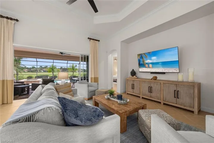 Tray ceiling, recessed lighting, tile flooring, sliding glass doors, screened patio