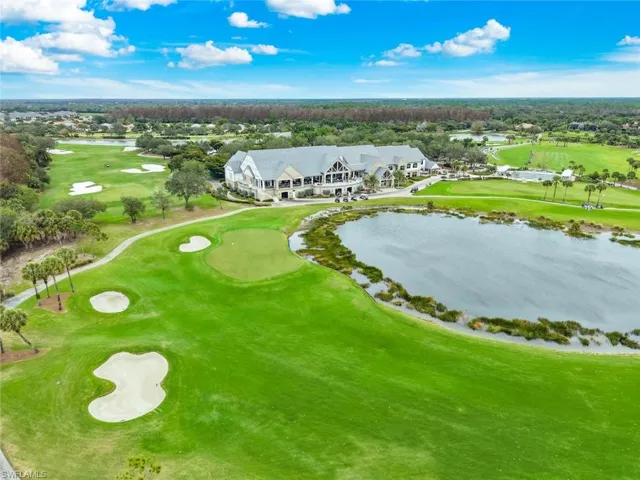 Golf course and clubhouse at TwinEagles Country Club in Naples FL