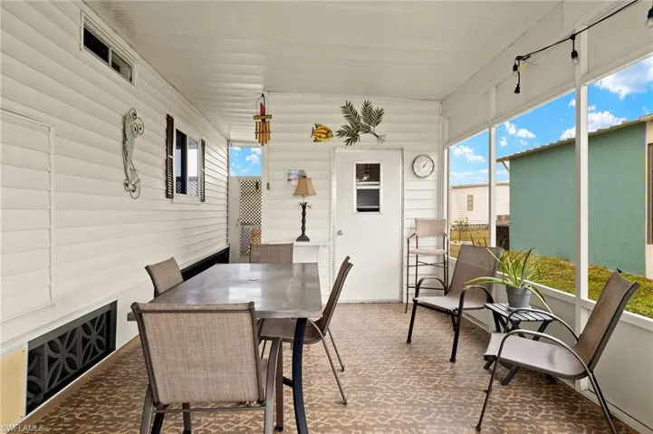 Sunroom with outdoor dining area