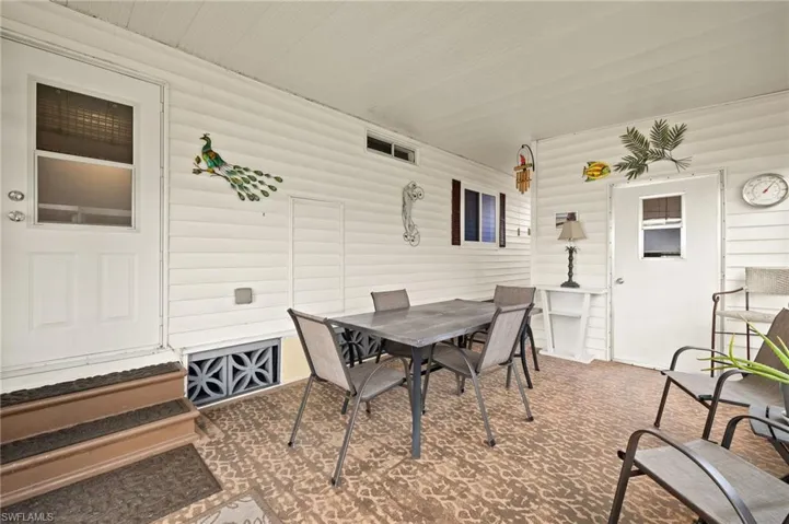 View of patio with outdoor dining area