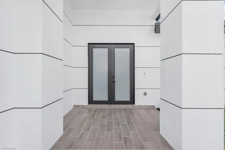 Entrance to property featuring french doors