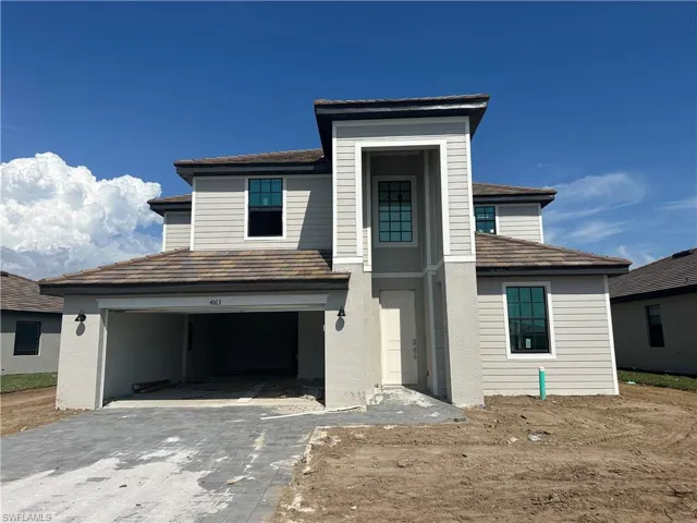 View of front of property featuring a garage