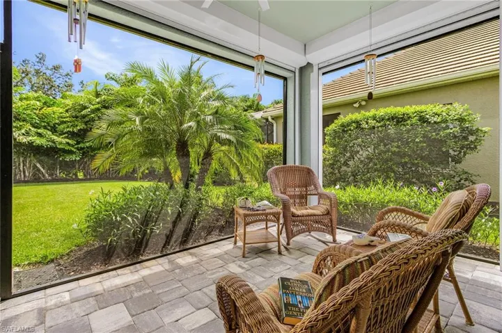Sunroom / solarium featuring stone tile flooring