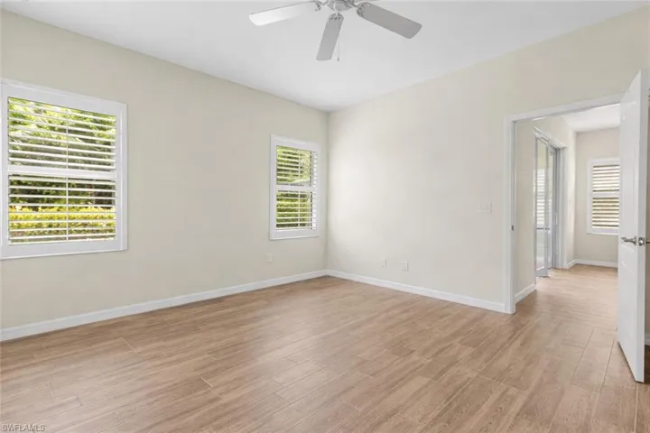 Unfurnished room featuring light wood-style flooring and a ceiling fan