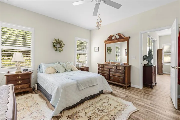 Bedroom featuring light wood-style flooring and a ceiling fan