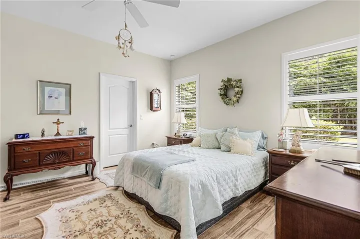 Bedroom with light wood-type flooring and ceiling fan