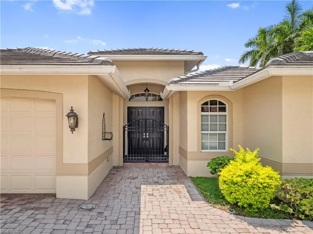 Entrance to property featuring a garage