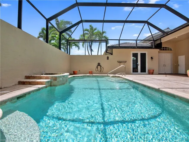 View of pool featuring a patio, french doors, and a lanai