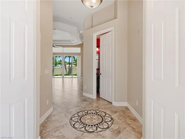 Foyer featuring light tile patterned flooring