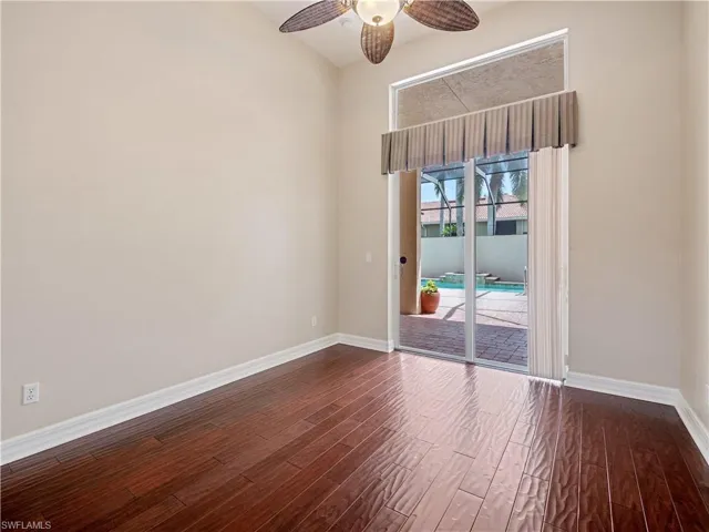 Spare room with ceiling fan and hardwood / wood-style floors