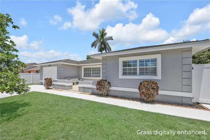 Single story home with a garage and stucco siding