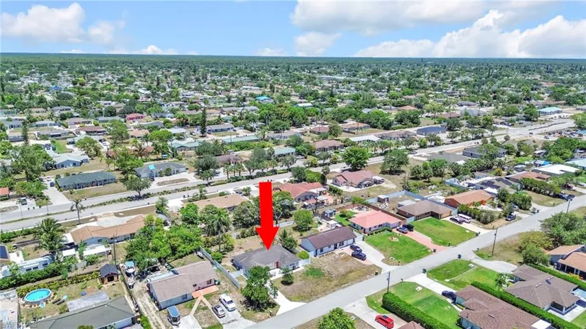 Aerial overview of property's location with nearby suburban area