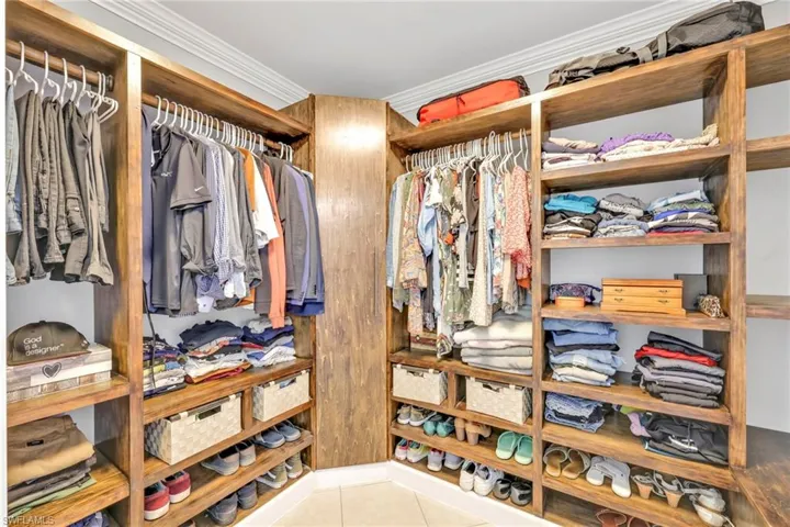 Spacious closet featuring tile patterned flooring