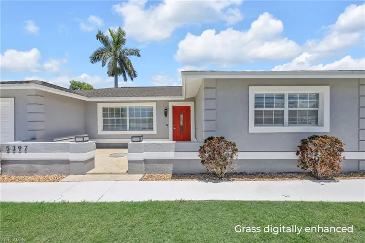 Ranch-style house featuring stucco siding