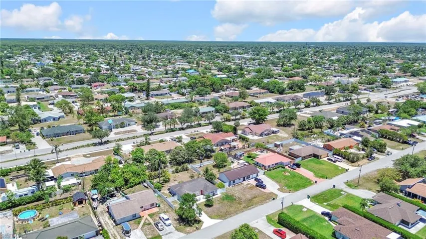 Aerial view of property's location featuring nearby suburban area