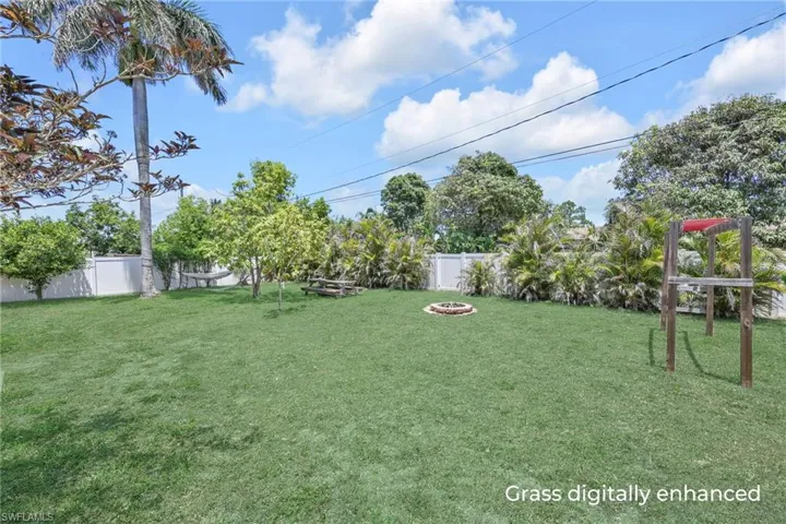 View of yard with an outdoor fire pit