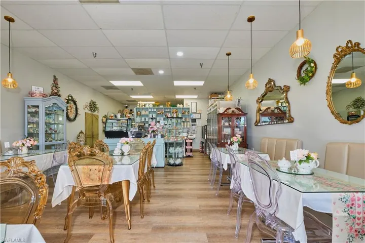 Dining space with wood finished floors and a paneled ceiling