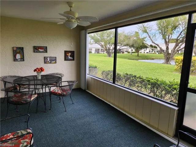 Sunroom / solarium featuring ceiling fan