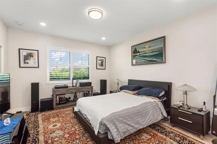 Well-lit room featuring recessed lighting and a central flush-mount fixture