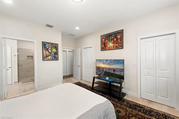 Bedroom featuring light neutral walls and recessed lighting