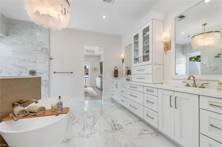 Bathroom with a tub and vanity