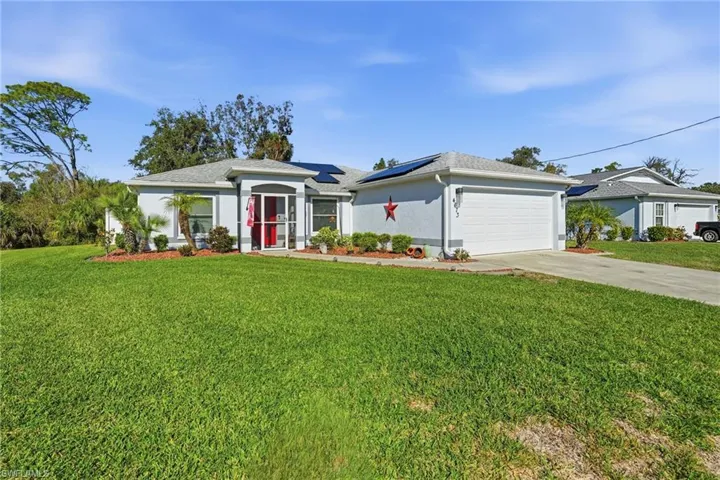Front of house w/ 2-car garage