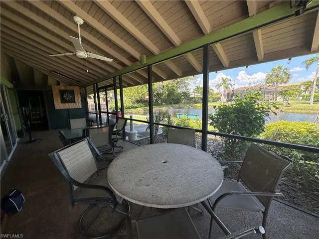 outdoor seating area at community clubhouse overlooking pond