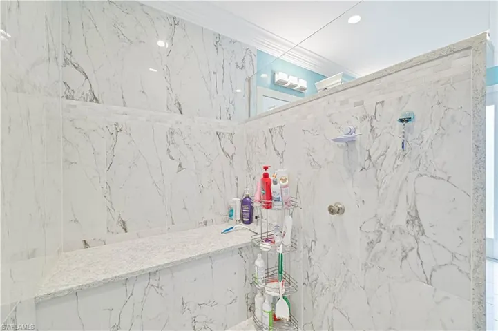Bathroom featuring a tile shower