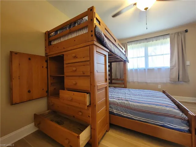 Room featuring light wood-finish flooring and a window with natural light