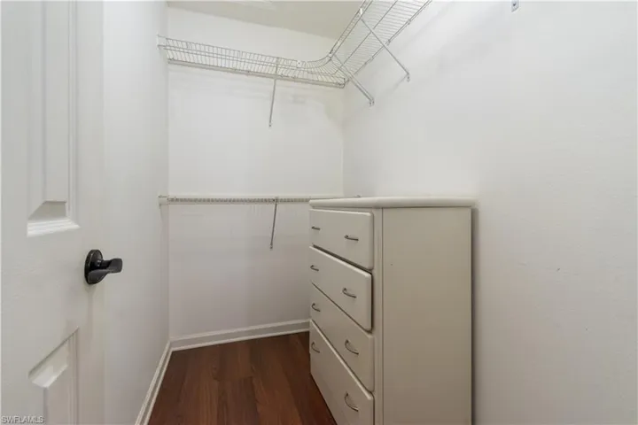 Primary bedroom walk-in closet