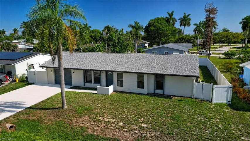 New light gray shingle roof and privacy fence