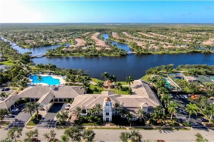 The property offers expansive water views, a large resort-style pool, and tennis courts