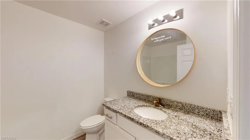 Bathroom featuring toilet and vanity