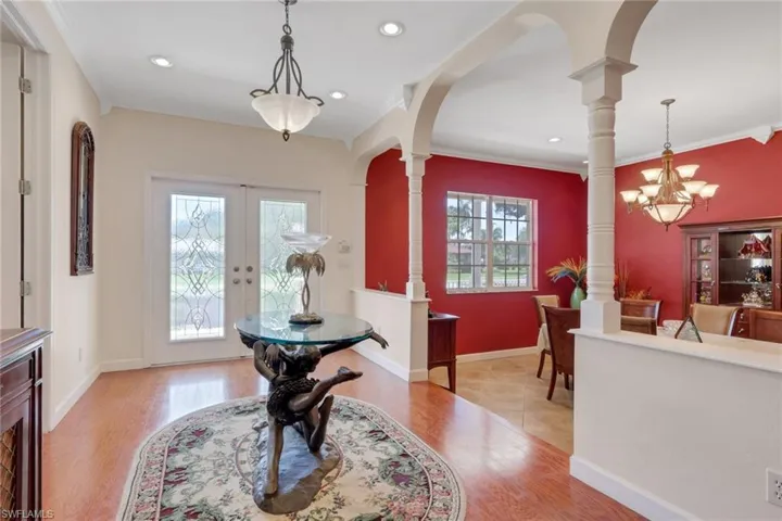 Entryway featuring double doors with decorative glass panels