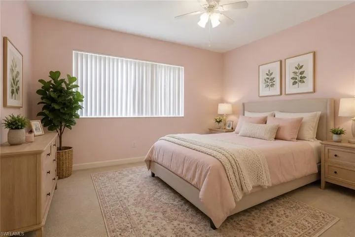 Staged Carpeted bedroom featuring a ceiling fan, a window with vertical blinds, and neutral-toned baseboards