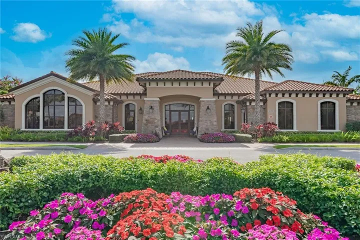 View of front of home featuring french doors, stucco siding, a tiled roof, and stone siding