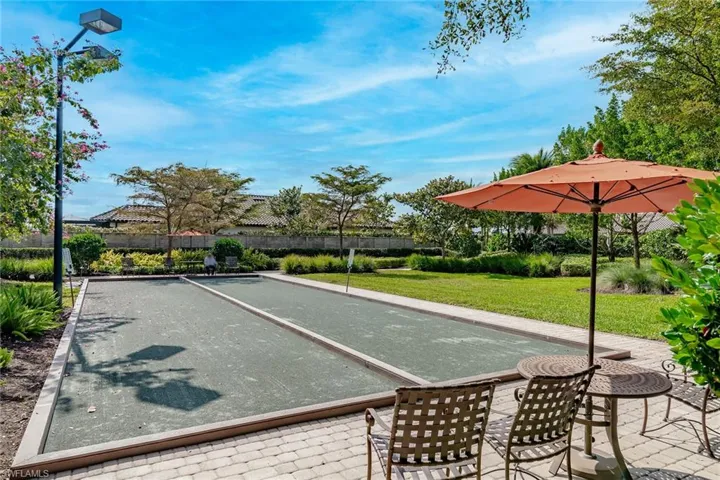 Surrounding community with a bocce ball area and a patio
