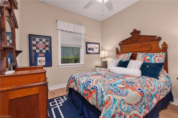 Bedroom with ceiling fan and light hardwood / wood-style floors