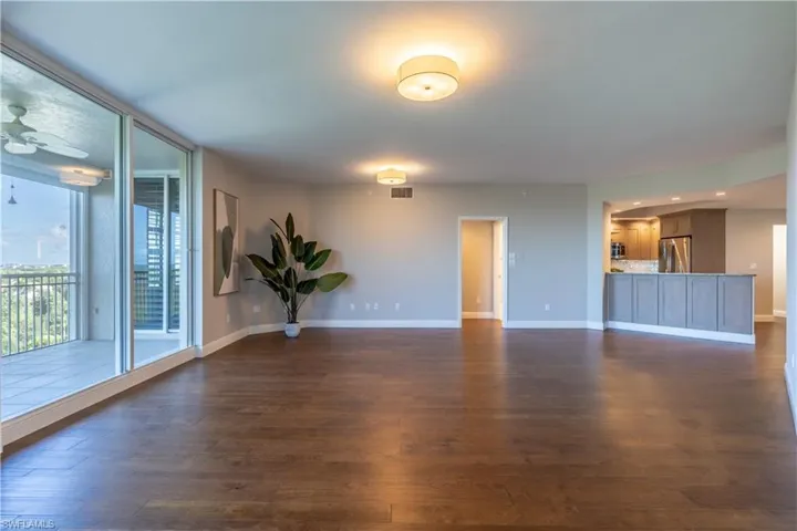 Kitchen with stainless steel appliances, farmhouse sink and views out over the Gulf!