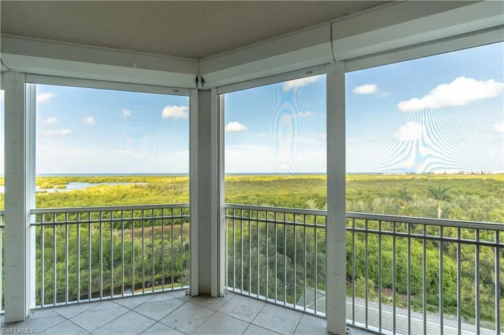 Great room with hardwood flooring and access to lanai