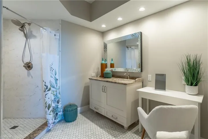 Primary bath with classic tile, walk in shower and separate water closet